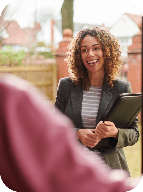 Mental health counselor smiles with a file in her hand